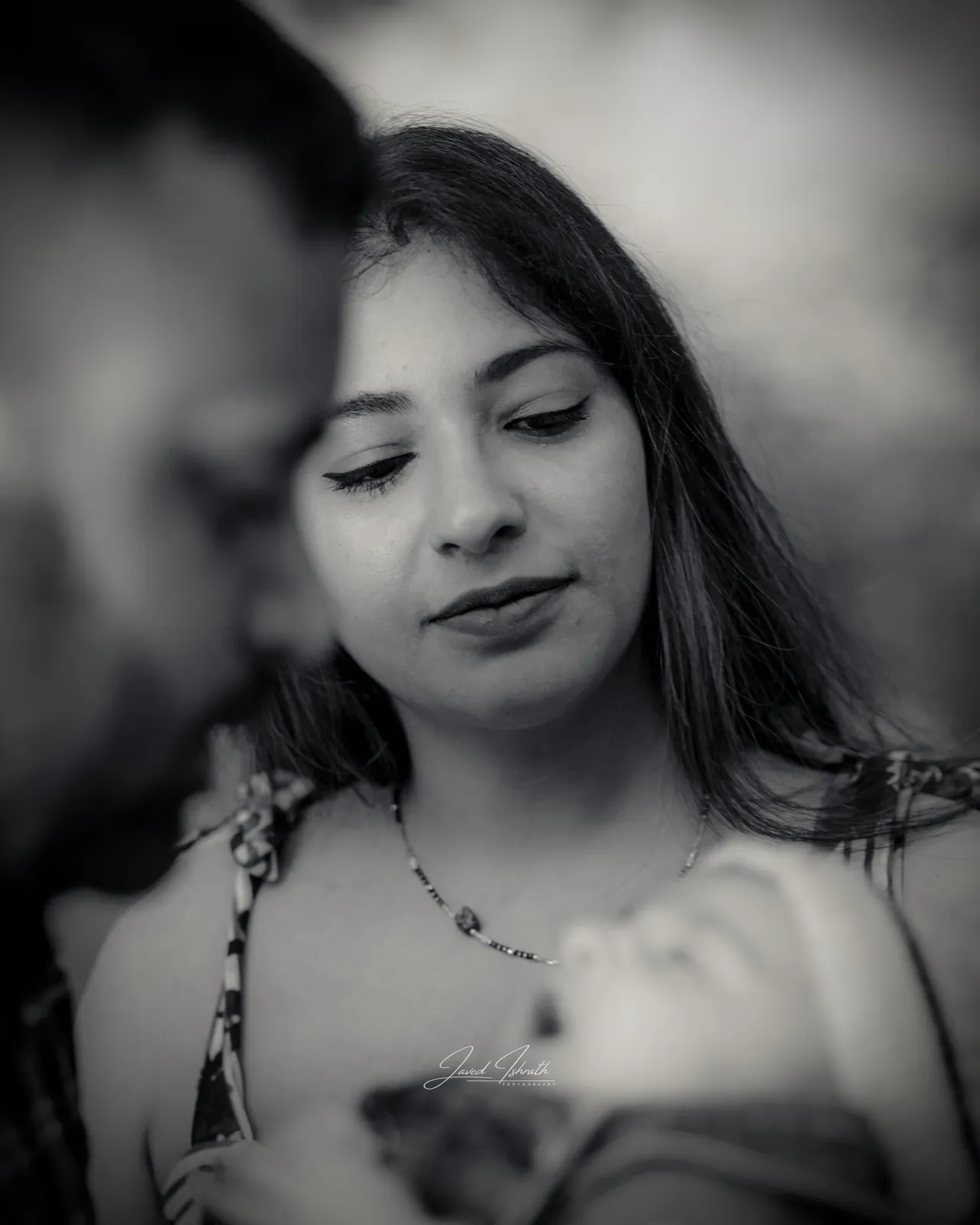 Black and white portrait of a mother with her baby